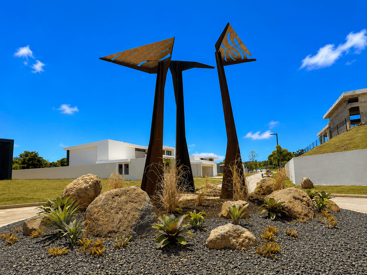 Corten steel sculptures with landscaped rock garden