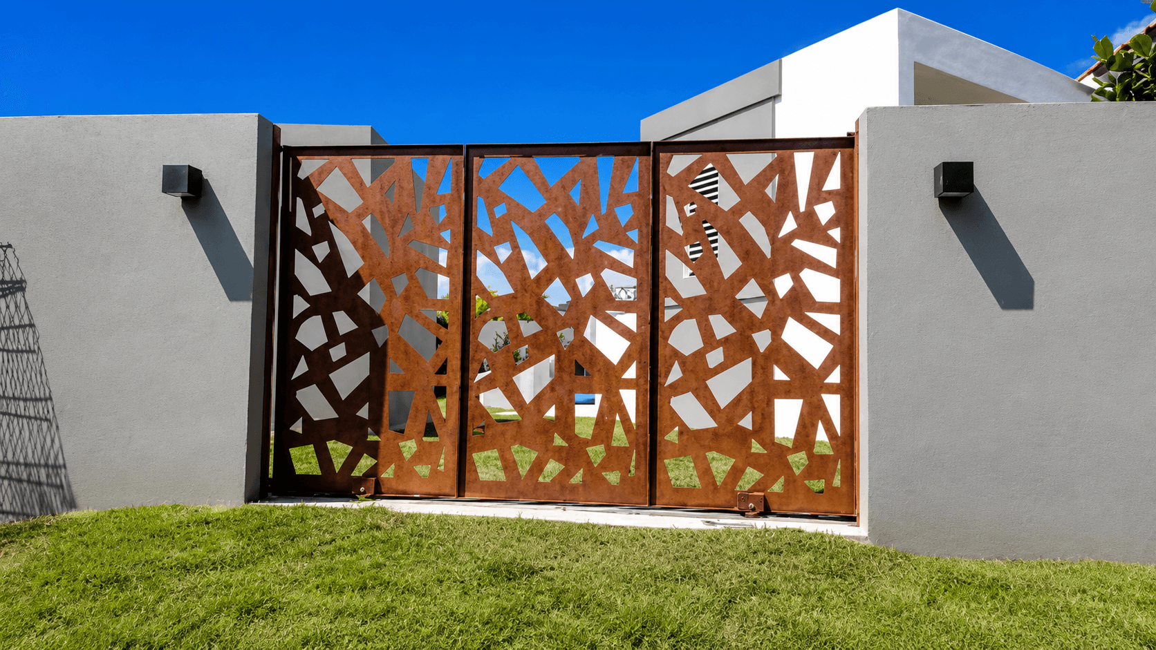 Corten steel gate with abstract branch pattern