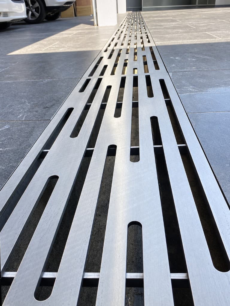 Waterjet-cut stainless steel linear drain grate