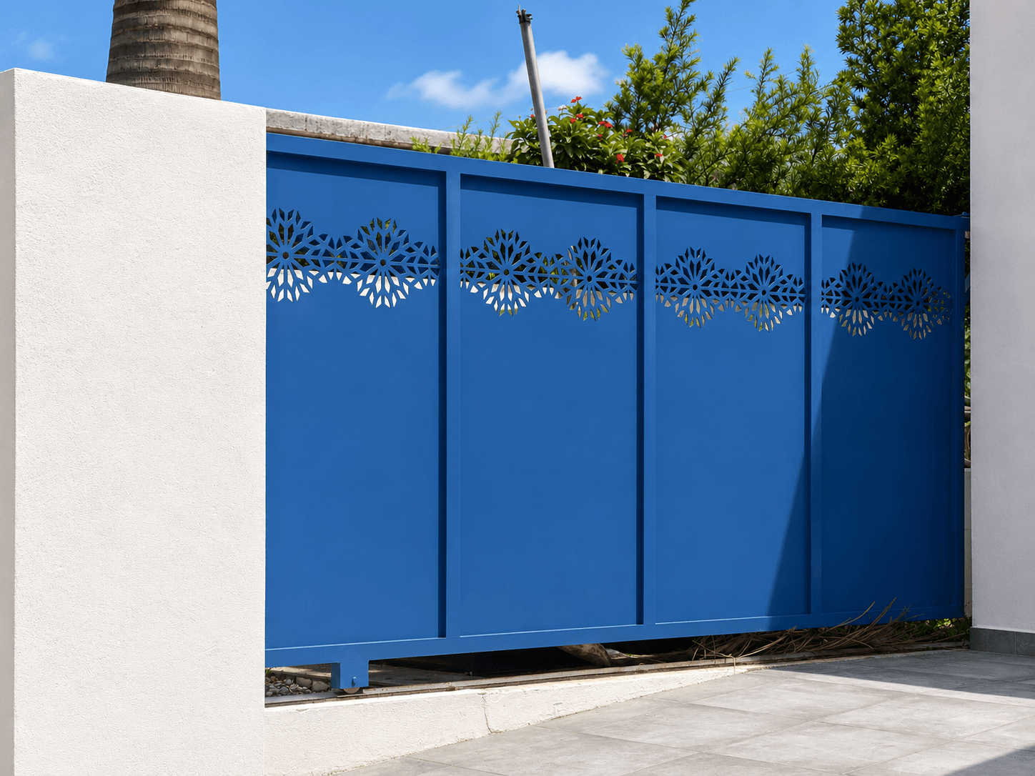 Blue gate panel with waterjet-cut floral pattern