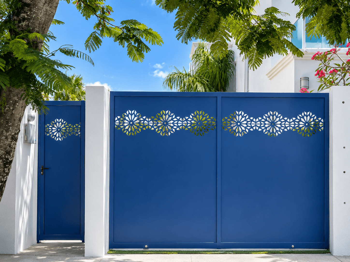 Blue driveway gate with geometric floral cutouts