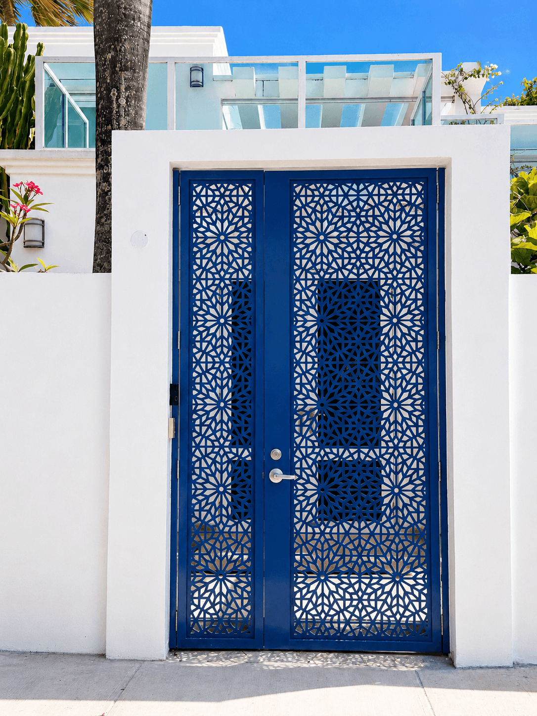 Blue double door with intricate geometric pattern