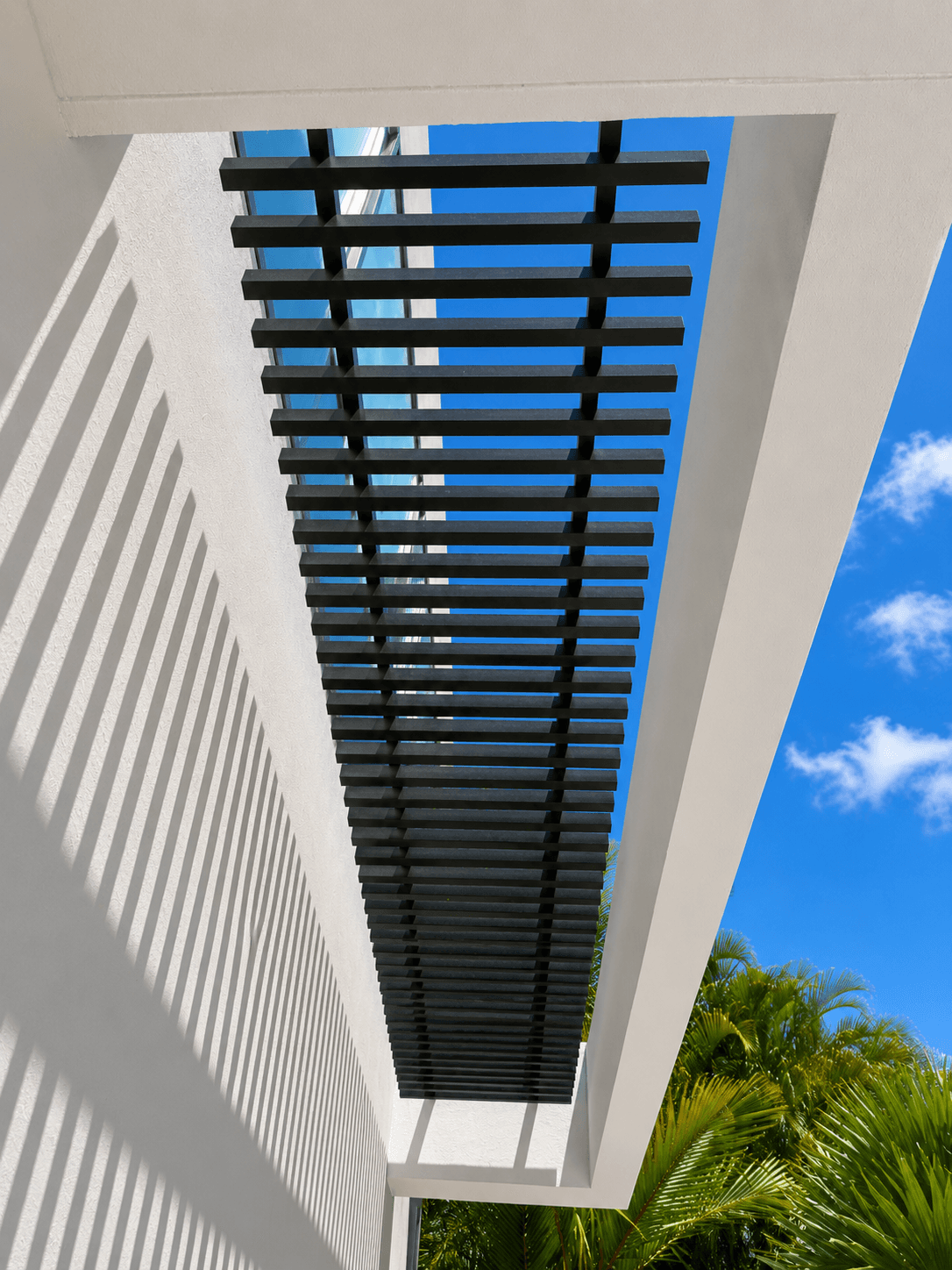 Metal louver pergola casting shadow patterns
