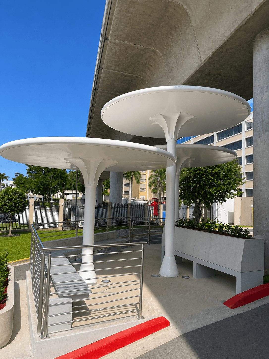 Mushroom shade structures with metal railings