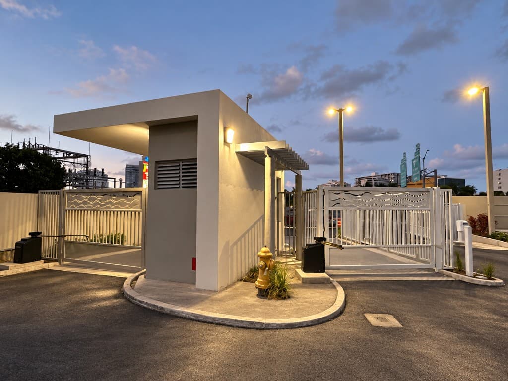 Guard house with waterjet wave gate at dusk